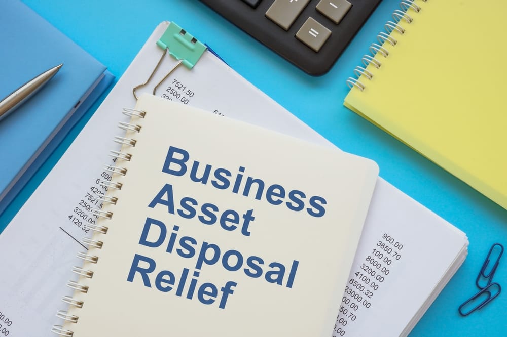 Stack,Of,Financial,Papers,And,Book,Business,Asset,Disposal,Relief.
