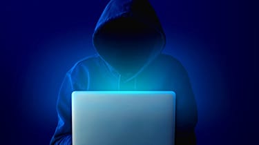 Portrait,Of,Anonymous,Man,In,Black,Hoodie,And,Mask,Hacking