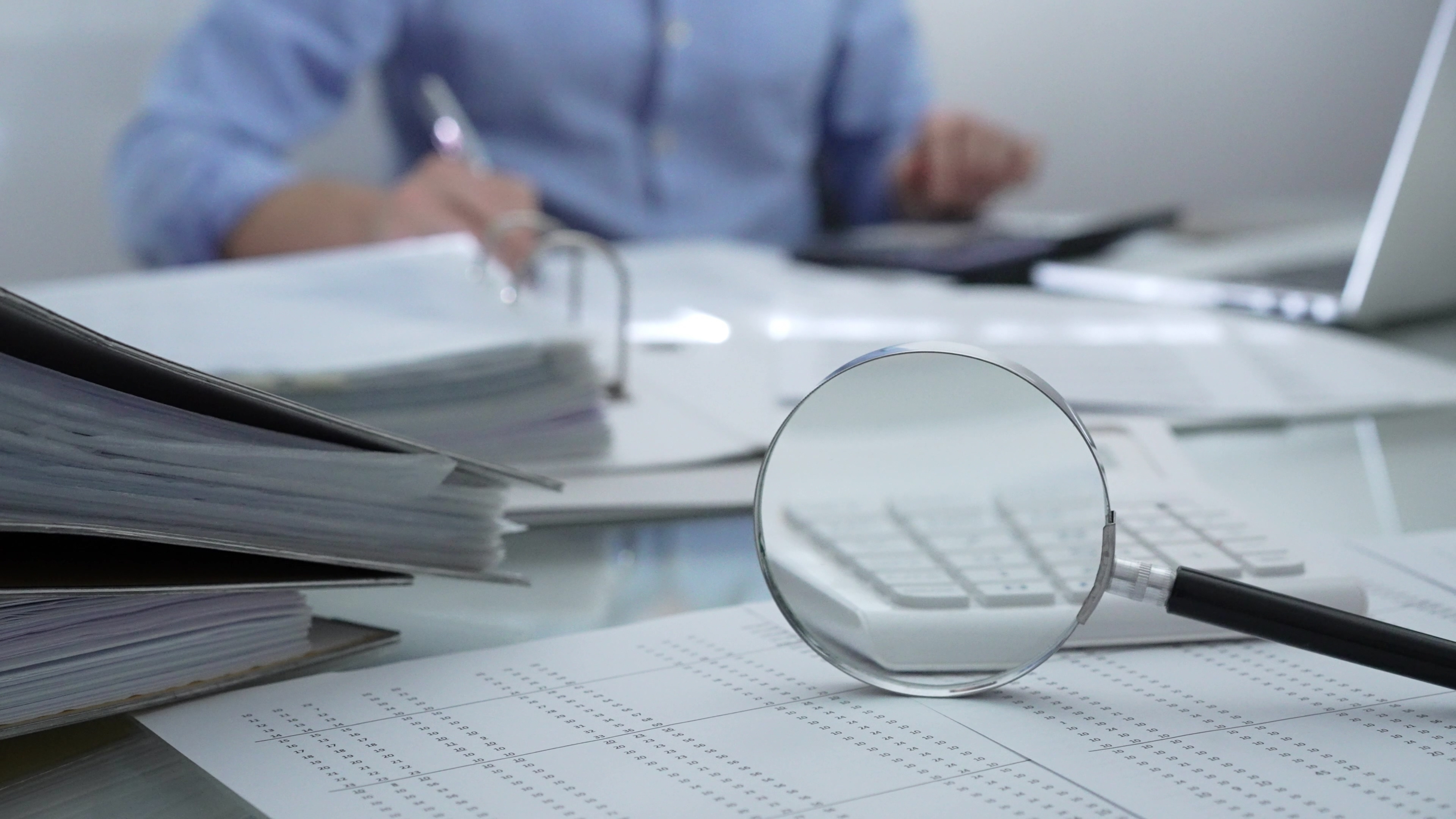 Magnifying,Glass,,Calculator,,Pen,And,Documents,Are,Lying,On,Accountant's