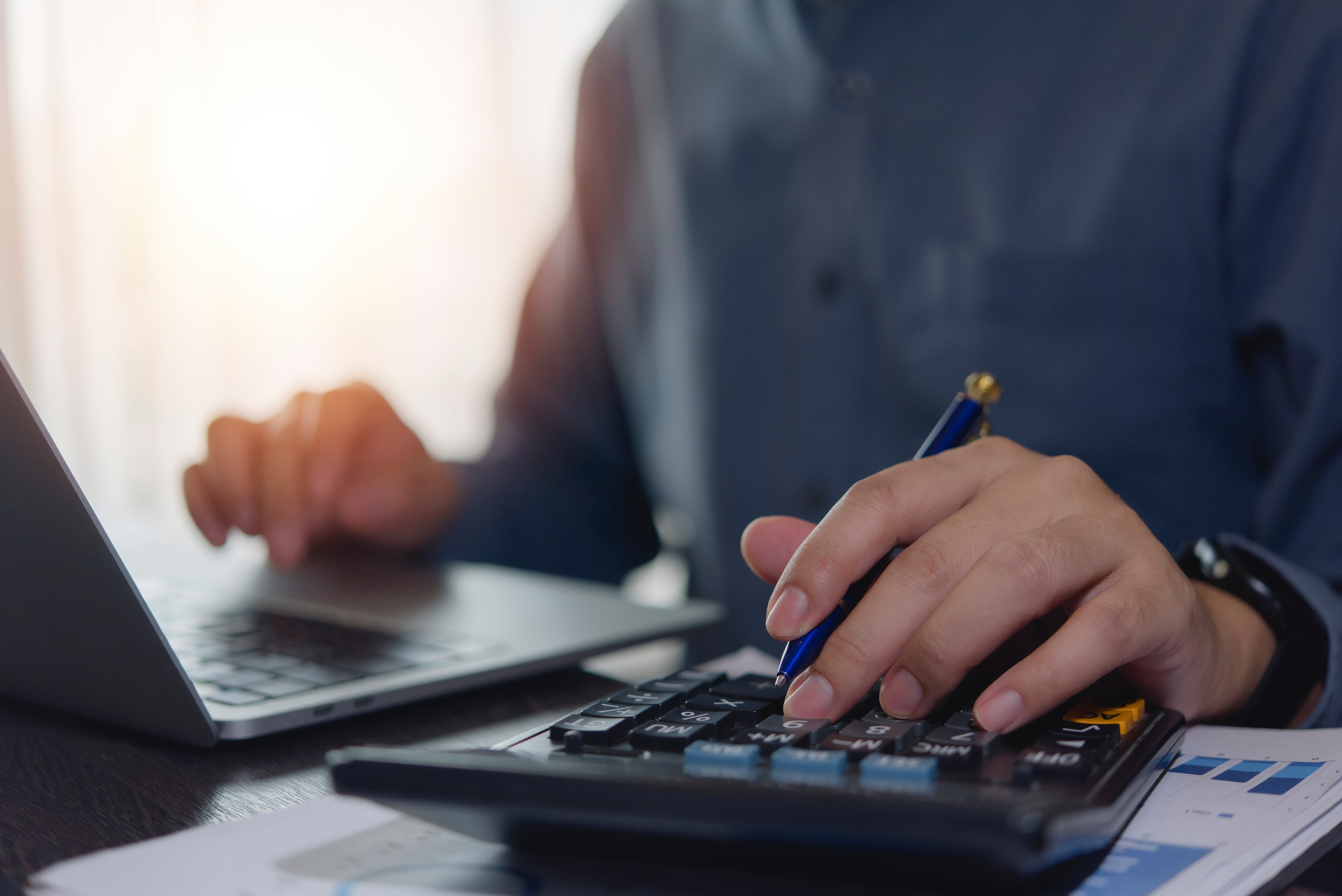 Accountant,Working,Hands,Using,Calculator,And,Laptop.,Business,Finance,Planning